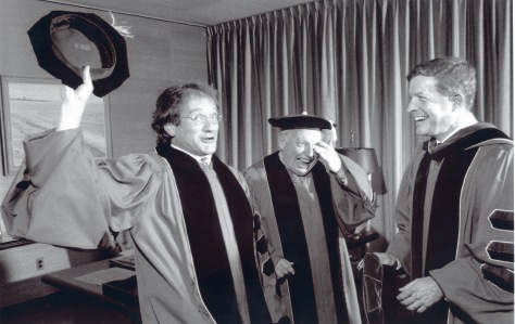 1991: From left: Robin Williams received an honorary Doctor of Fine Arts at The Juilliard School.  Violinist Isaac Stern was the Commencement Speaker and Juilliard President Joseph W. Polisi was in attendance.  Photo Credit: Henry Grossman.
